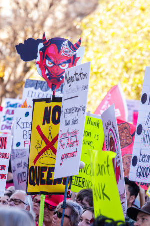 Protest signs at a teachers rally at the Alberta Legislature